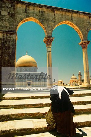 Rear view of a man walking up steps of a shrine, Dome Of The Rock, Jerusalem, Israel