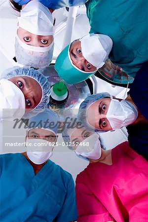 Low angle view of surgeons in an operating room