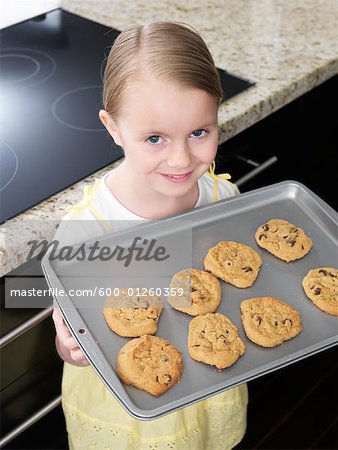 Little Girl Holding Cookies