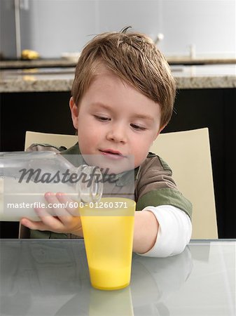 Little Boy Pouring Milk