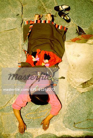 High angle view of a worshipper praying in a temple, Jokhang temple, Lhasa, Tibet, China