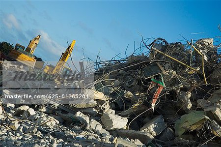 Low angle view of earth movers at a construction site