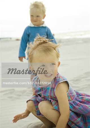 Two toddlers on beach