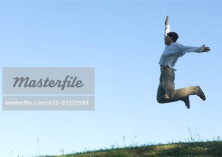 Man jumping in the air, arms out