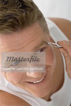Man Plucking Eyebrows