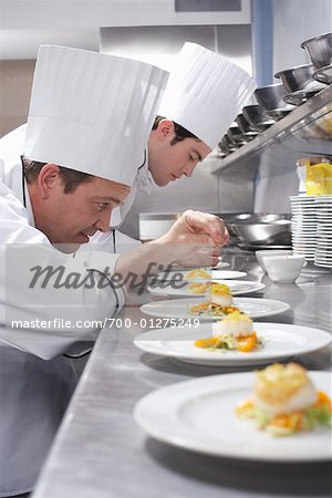 Chefs Garnishing Dishes