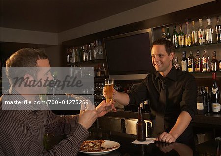 Bartender Serving Beer to Customer