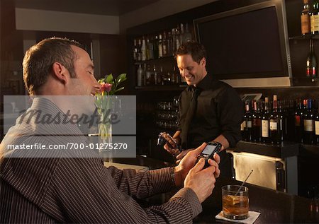 Man at a Bar, Reading Text Message
