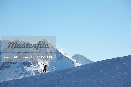 Skiier Climbing Hill, Whistler, British Columbia, Canada
