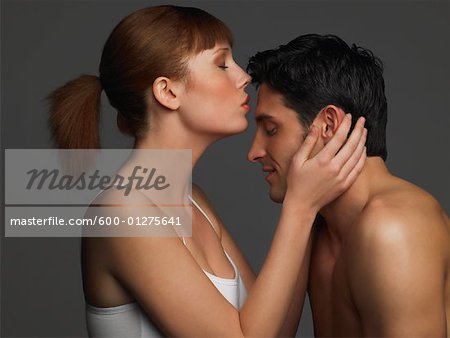 Woman Kissing Man's Forehead