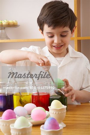 Child Making Easter Eggs