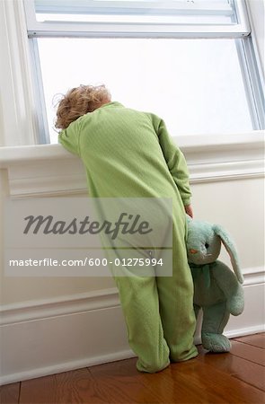 Child Standing by Window