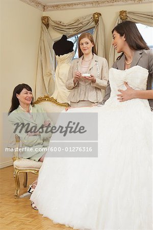 Saleswoman and Clients in Bridal Boutique