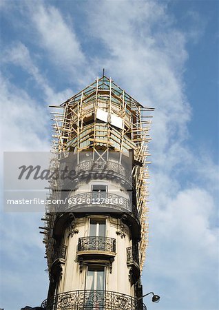 Apartment building undergoing renovation, low angle view