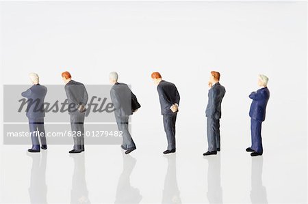 Businessmen figurines standing in a row