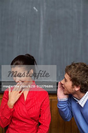 Young man is abashing a Japanese woman, close-up