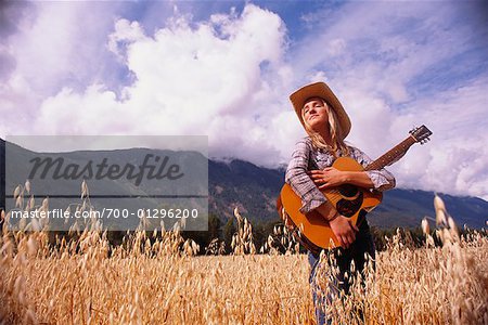 Portrait of Cowgirl With Guitar