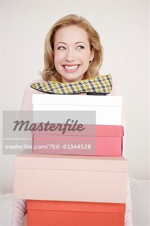 Woman Holding Shoeboxes