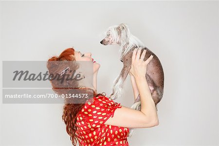 Woman Lifting Dog