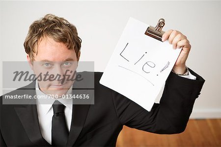 Businessman Holding Clipboard