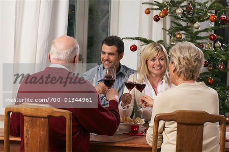 Family Toasting at Dinner Table