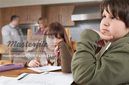 Children doing Homework at Kitchen Table