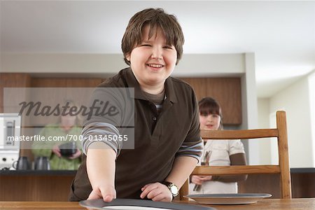 Boy Setting Table