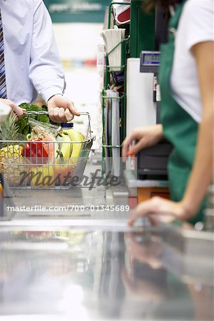 Man at Check-out Counter in Grocery Store