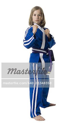 Portrait of a girl posing in a martial arts stance