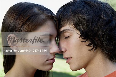 Close-up of a teenage couple kissing