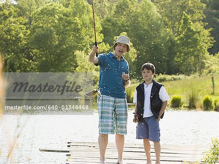 man and his son fishing