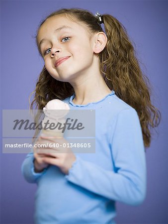 Close-up of a girl holding an ice cream cone