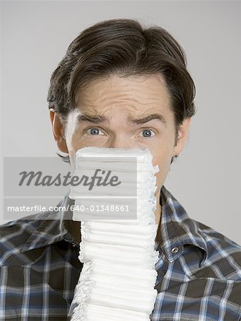 Portrait of a man holding a stack of diapers