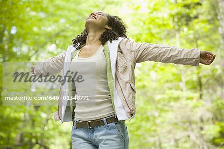 Close-up of a young woman with her arms outstretched