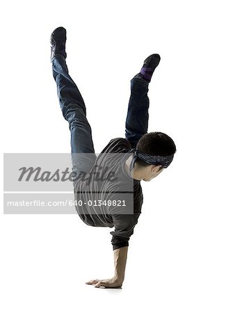 Rear view of a young man break dancing