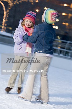 Two girls outdoors in winter smiling