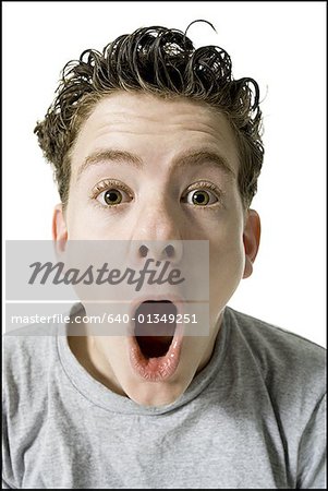 Portrait of a teenage boy with his mouth open