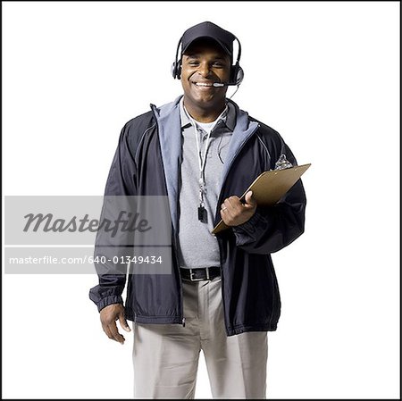 Coach mit Zwischenablage und lächelnd headset