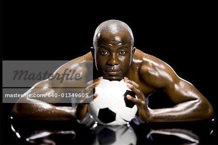 Athlete posing with soccer ball