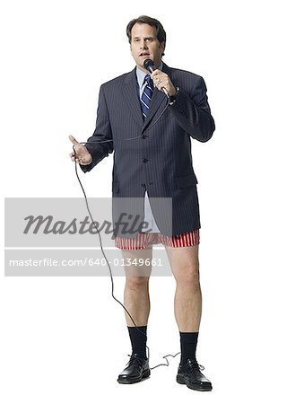 Businessman in boxers with microphone
