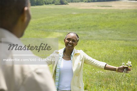 Senior woman smiling in front of a senior man