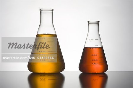 Close-up of two liquid filled flasks