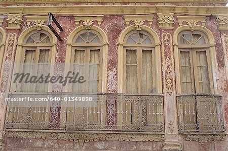 Low angle view of a balcony of a dilapidated building