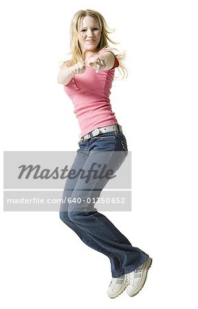 Profile of a young woman jumping