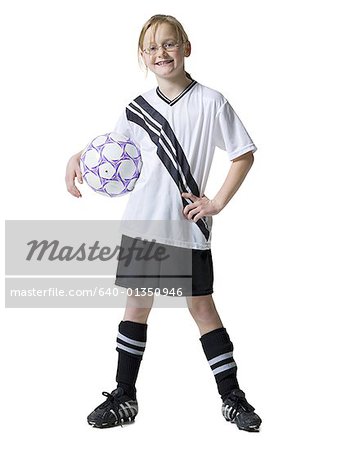 Portrait of a girl holding a soccer ball