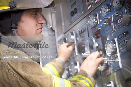 Profile of a firefighter operating controls