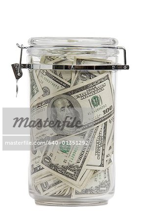 Close-up of dollar bills in a jar