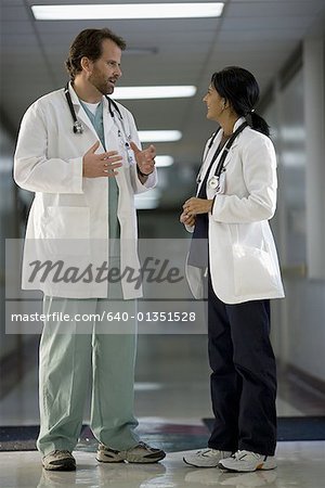 Profile of two doctors discussing