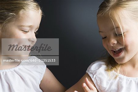 Close-up of two sisters smiling