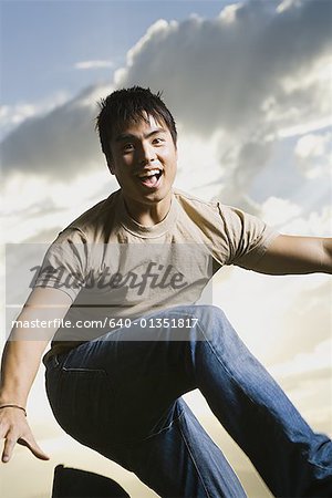 Young man jumping and smiling